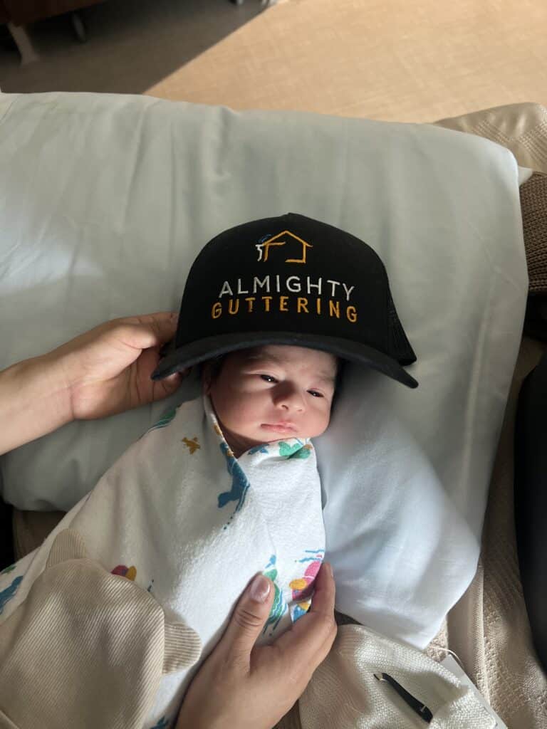 A cute new born baby with Almighty Guttering Cap